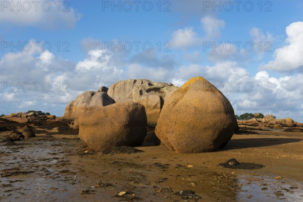 Rock formations under a bright blue sky on the coast, Baie de Sainte-Anne, Trégastel, Tregastel,