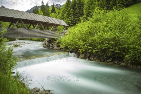Covered wooden bridge over the Stillach, Stillachtal near Oberstdorf, Allgäu Alps, Allgäu, Bavaria,