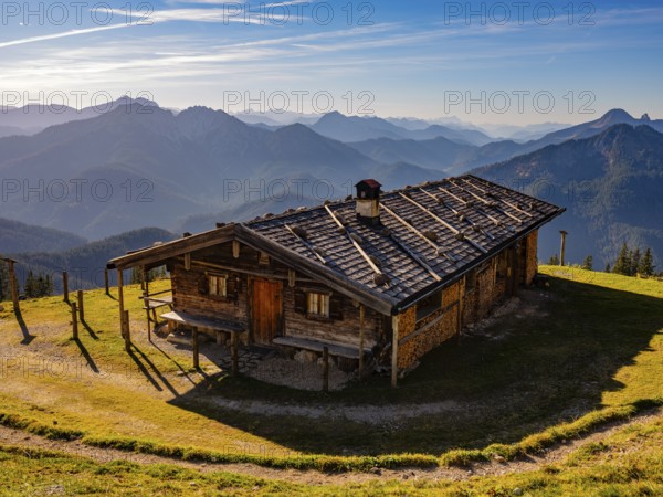 Wildfeldalm in front of alpine panorama, silhouette of mountain ranges, Mangfall mountains,