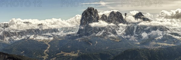 Panoramic view of the majestic mountain peaks of the Sella Group towering into the sky, surrounded