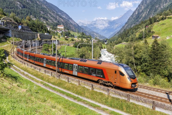 Railway passenger train of the type Stadler Flirt of the Südostbahn on the Gotthard railway in the