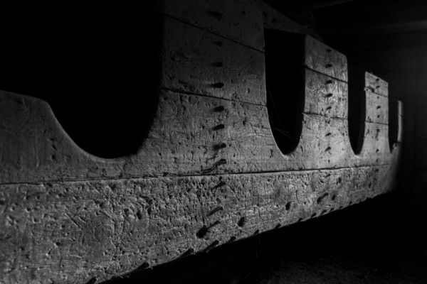 Shadow play on a raw wooden structure in a dark atmosphere, Neukirchen am Großvenediger, Salzburg,