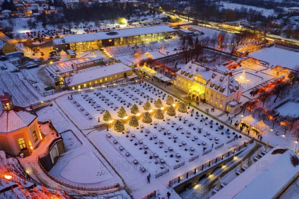 Aerial view of Wackerbarth Castle with castle park, belvedere and vineyards with snow and Christmas