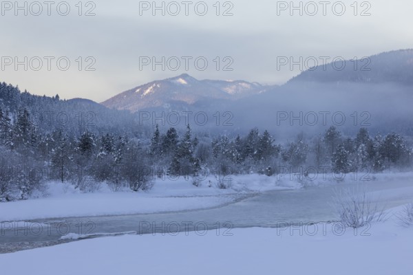 Isar valley in winter at temperatures of minus 18 degrees Celsius. Snow covered landscape with the