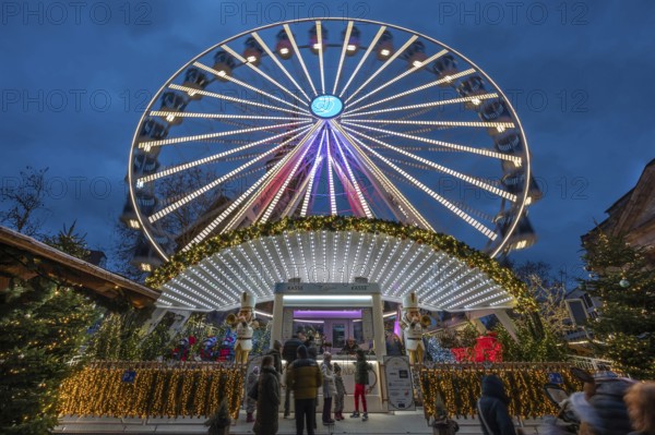 Ferris wheel at the winter village, Christmas market at dusk, Jakobsplatz, Nuremberg, Middle