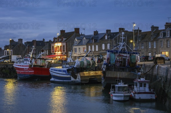 Barfleur, Normandy, France - Fishing boats on the quay in the harbour of Barfleur, a picturesque