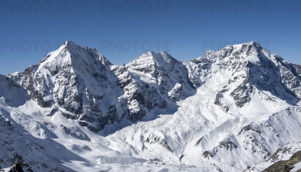 Snow-covered mountain landscape in winter, view of mountain peaks Königsspitze, Monte Zebru and