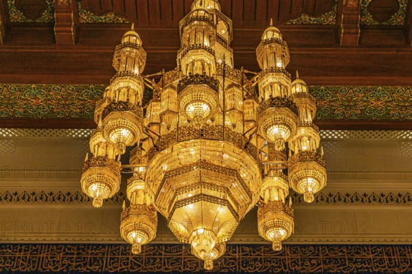 Illuminated chandelier in the Sultan Qaboos Mosque, Muscat, Arabian Peninsula, Sultanate of Oman