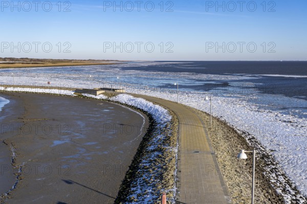 The East Frisian North Sea island of Juist in winter, harbour area, Juist pier, frozen coast facing
