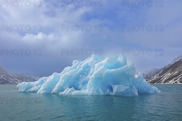 Iceberg melting in summer in Magdalenefjorden, fjord in Albert I Land on Svalbard, Spitsbergen,
