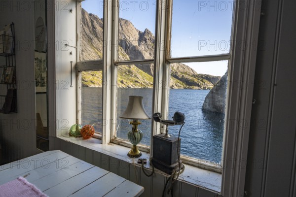 View from the window of a café, fishing village Nusfjord, Lofoten, Norway, Europe