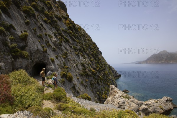 Hikers on the Sarella peninsula near Plakias, south coast, Crete, Greece, Europe