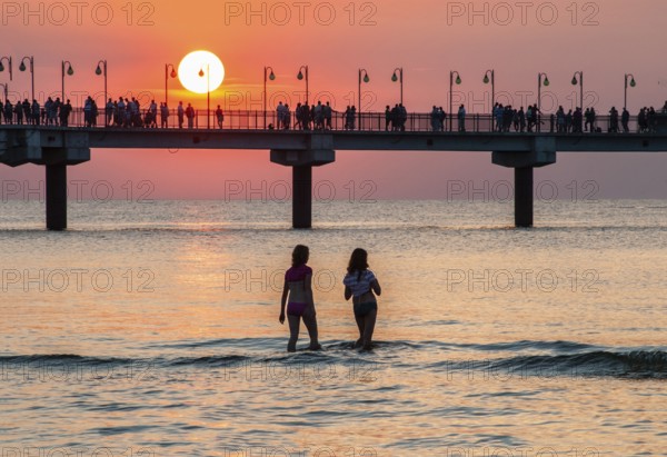 Sunset at the pier in Miedzyzdroje, Western Pomerania, Poland, East Europe, Europe