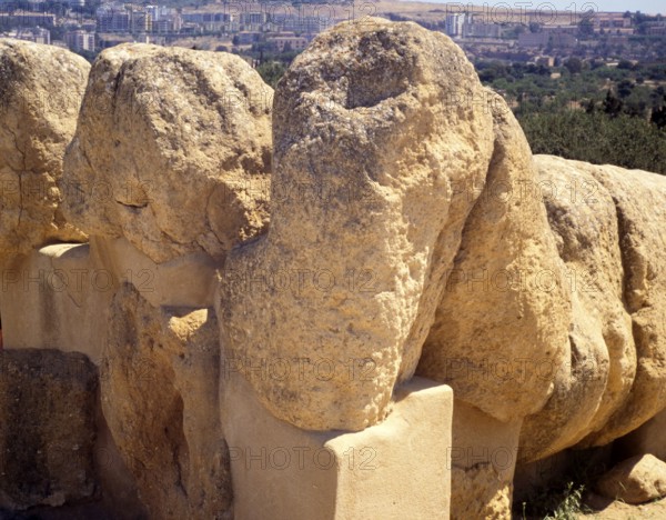 Head and arms Greek ruins Giant statue of Atlas or Telamon, Temple of Zeus, Akragas, Agrigento,