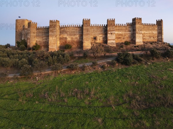 The impressive Moorish Burgalimar castle at the town of Baños de la Encina. Drone shot. Jaén
