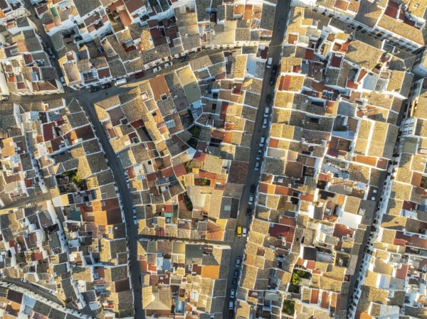 Streets and rooftops in the White Town of Olvera. Aerial view. Drone shot. Cádiz province,