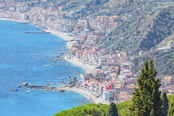View of the Ionian coast and Giardini di Naxos in the distance, Taormina, Sicily, Italy, Europe