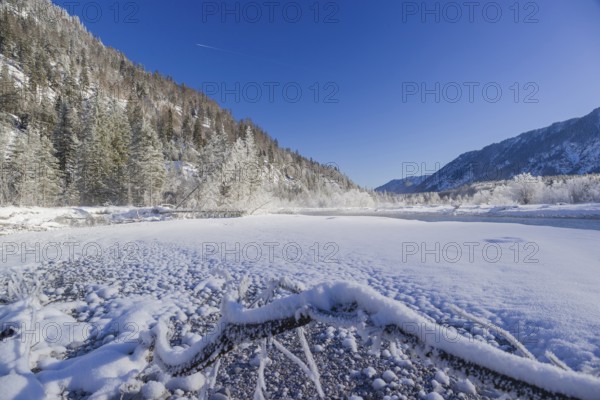 Isar valley in winter at temperatures of minus 18 degrees Celsius. Snow covered landscape with the