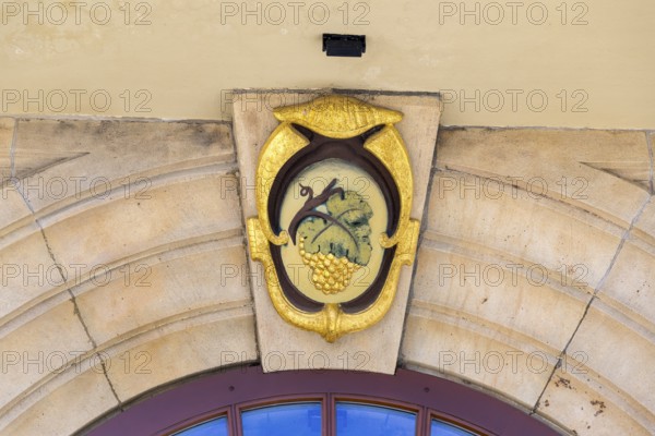 Coat of arms with grapevine as keystone on the town hall portal, Weinböhla, Saxony, Germany, Europe