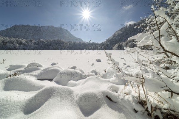 Freibergsee in winter, near Oberstdorf, behind it the Himmelschrofen, 1791m, and the Heini-Klopfer