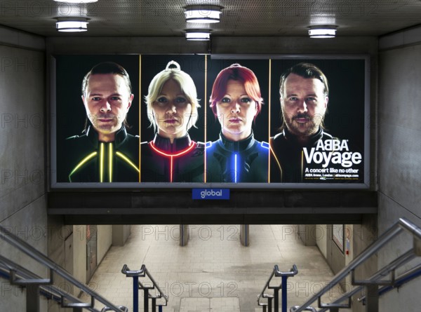 Electronic advertising poster hologram faces pop group Abba promoting Abba Voyage concert, London,