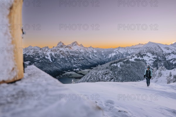 Summit bliss in the snow-covered winter landscape in the Tannheimer Tal in the Alps on the
