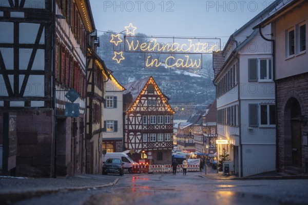 Christmas-lit street with half-timbered houses and wintry backdrop, Calw Christmas market, Black