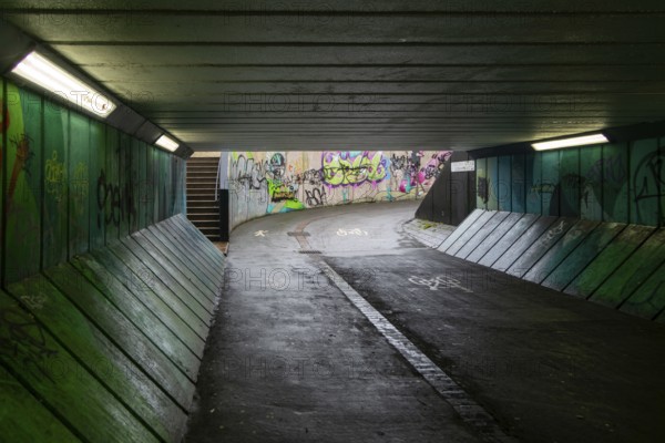 Graffiti paint sprayed tags on walls of Crescent Bridge Subway east underpass in city centre,