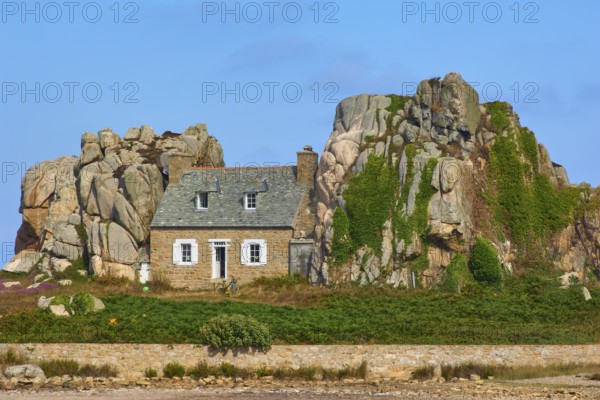 House between rocks, Le Gouffre de Plougrescant, Cote de Granit Rose, Cotes d'Armor, Brittany,