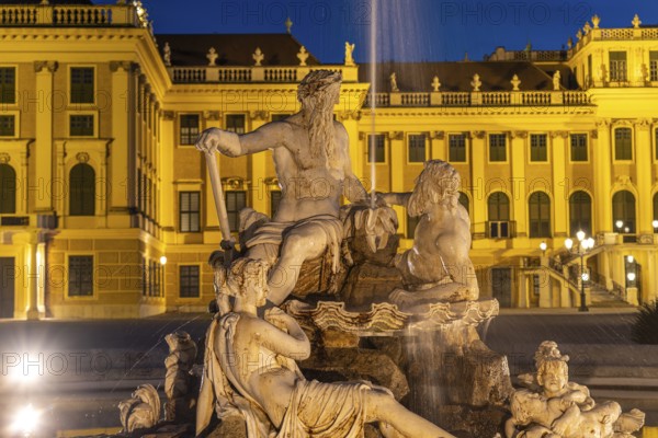 Fountain in the courtyard of honour at Schönbrunn Palace at dusk, UNESCO World Heritage Site in