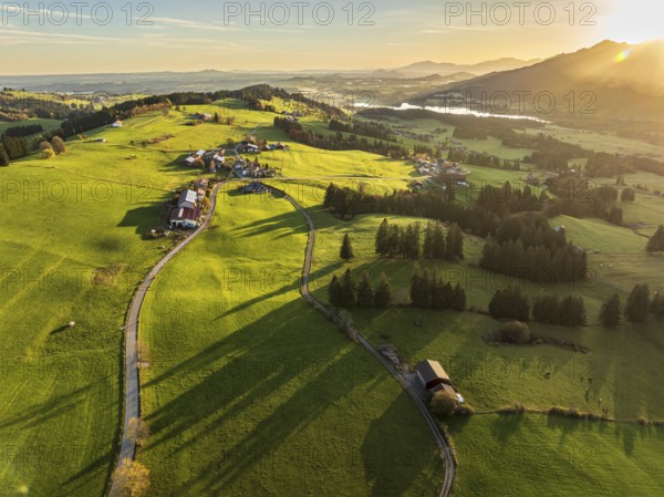 Mountain range near village Wertach, view to lake Gruentensee, sunrise, autumn colors, aerial view,