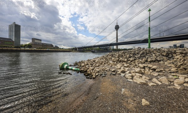 Düsseldorf, North Rhine-Westphalia, Germany, Overturned fairway buoy at low water in the Rhine in