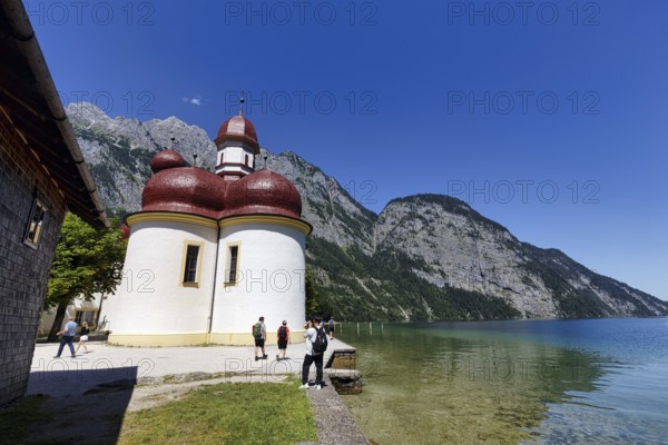 Pilgrimage church St. Bartholomä am Königssee with tourists, Berchtesgaden National Park,