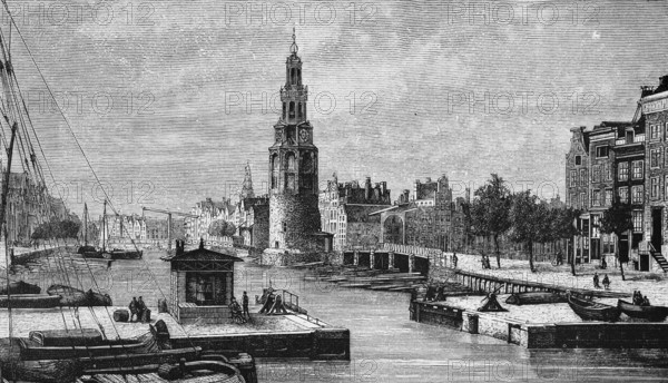 Harbour basin of the Dutch capital Amsterdam with Montelbaanstoren tower, lock, shipping traffic,