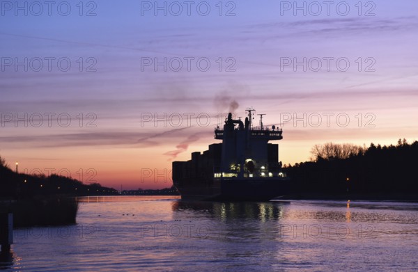 Container ship OOCL RAUMA at the blue hour, sunrise in the Kiel Canal, NOK, Kiel Canal,