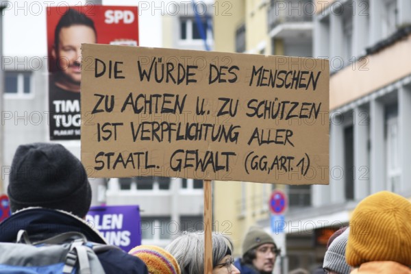 Heidelberg, Germany - February 12th 2025: Protest sign with text quoting the Basic Law for the