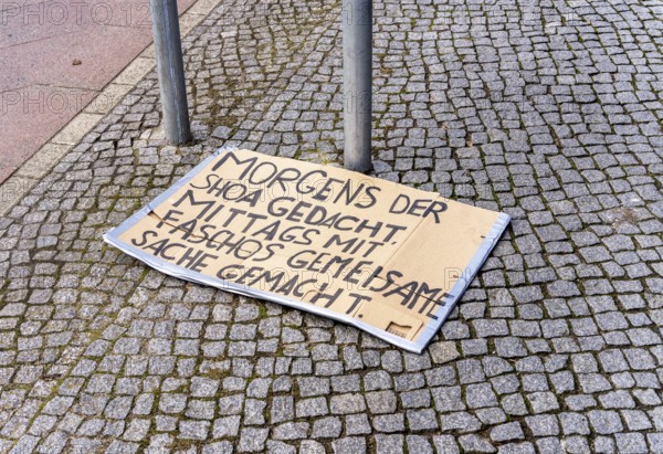On the pavement, cardboard with election slogan after a demonstration, Berlin, Germany, Europe