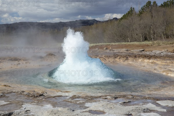 Strokkur is a fountain geyser located in a geothermal area in the southwest part of Iceland. It is