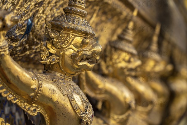 Row of gilded garudas, Wat Phra Kaeo, the king's Buddhist temple in the old royal palace, Grand