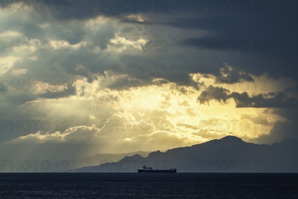 Sun rays in the clouds over Sicily, Tyrrhenian Sea, Italy, Europe