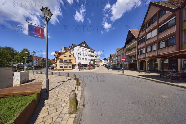 Lantern, general development, town coat of arms, blue sky with cumulus clouds, intersection of