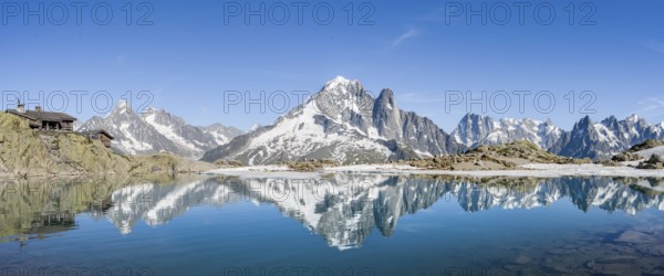 Mountain landscape with mountain lake, water reflection in Lac Blanc, mountain peak, Aiguille