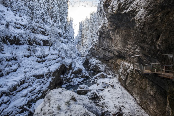 Winter, snowy landscape, river Breitach and hiking trail through the Breitachklamm gorge near