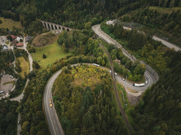 Winding road through forest and viaduct in hilly landscape, Ravenna Gorge, Black Forest, Germany,