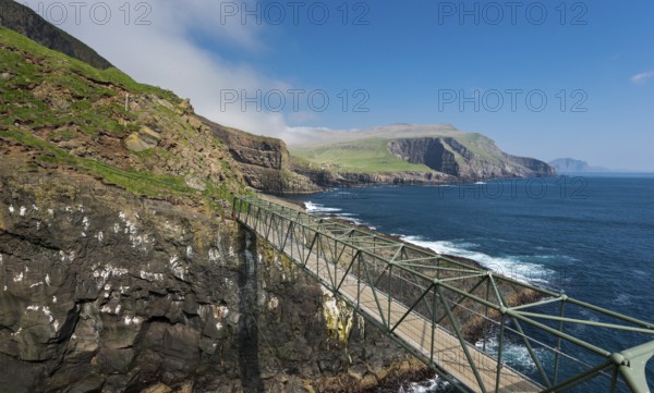 So-called Atlantic Bridge, pedestrian bridge over rock crevice Hólmgjógv, Mykines, Útoyggjar, Faroe