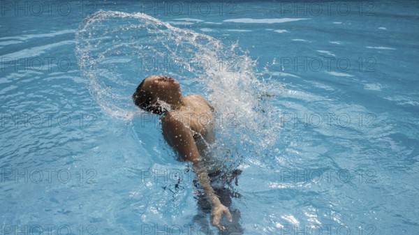 Thirteen-year-old boy, swimming pool