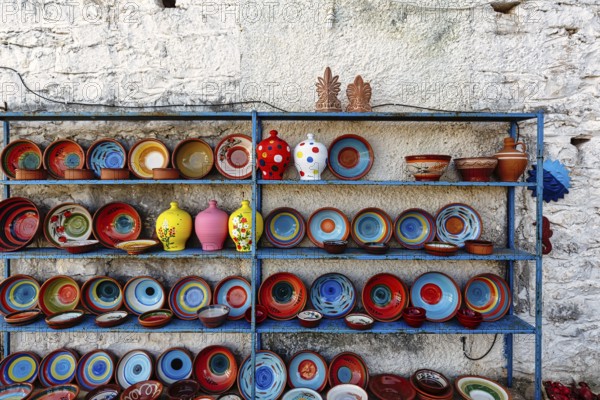 Colourful ceramics, outdoor shelf, pottery, souvenir shop in the village of Pyrgos Dirou, Mani,