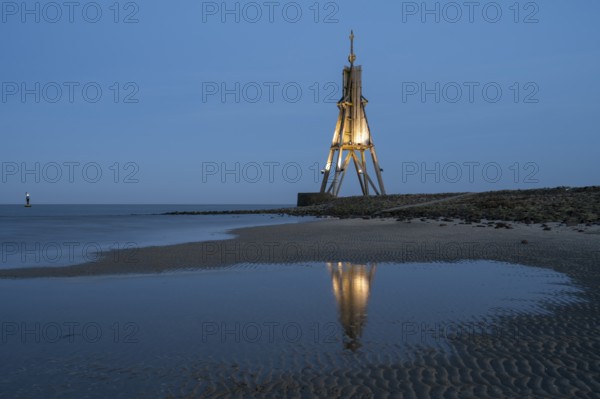 Illuminated spherical beacon with reflection, landmark, blue hour, North Sea, Lower Saxony Wadden