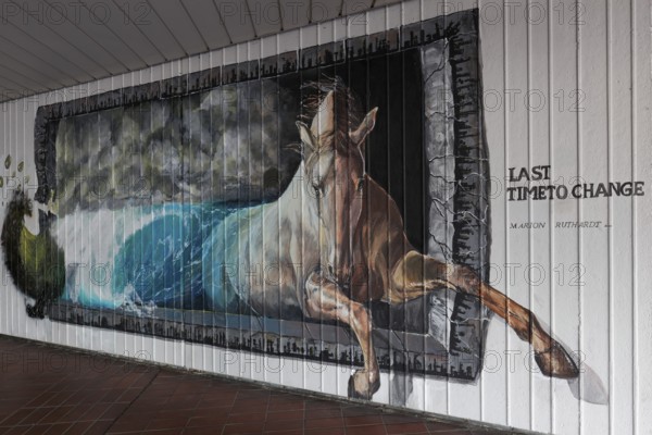 Horse jumps out of a wave, Last Time To Change, symbolic mural on the subject of global warming,