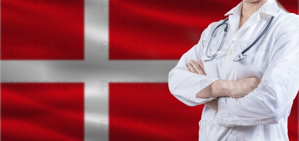 Doctor With Crossed Arms On Denmark Flag. Denmark Health And Care Concept. Female Doctor On Denmark